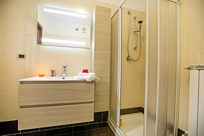 Family Apartment, Multiple Bedrooms (Borgo Degli Ulivi shared pool- 200m) | Bathroom | Shower, hair dryer, bidet, towels