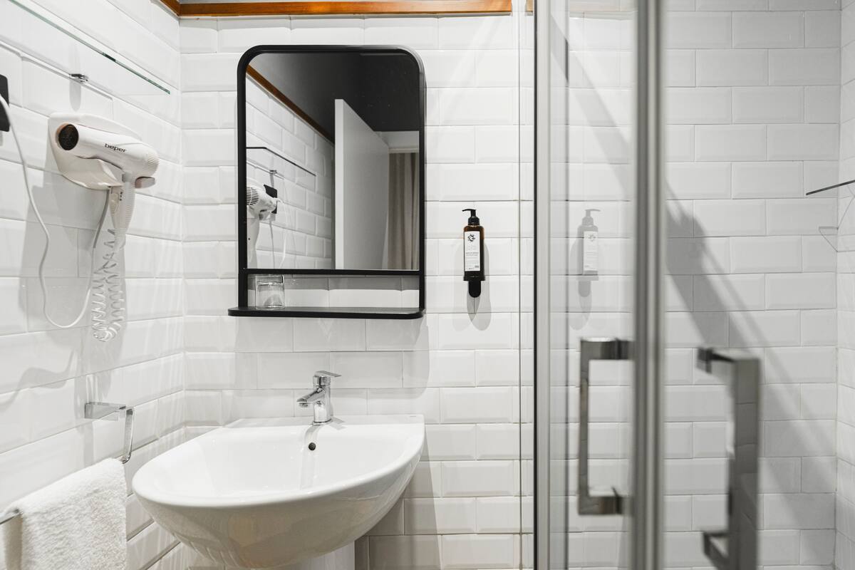 shower, hair dryer, towels, soap