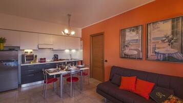 Family Apartment, 1 Bedroom, Balcony, Lakeside (Casa Fiorita: Leggiuno 100 meters) | Living area | Flat-screen TV