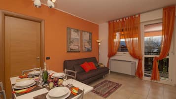 Family Apartment, Multiple Bedrooms, Lakeside (Casa Fiorita Pool and Lake) | Living area | Flat-screen TV