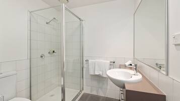 Combined shower/tub, hair dryer, towels, soap