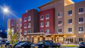 A hotel with a modern design, featuring a prominent sign for Towneplace Suites by Marriott.