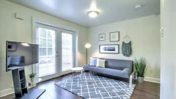 Design Condo, 1 Bedroom | Living area | 54-inch flat-screen TV with cable channels, TV