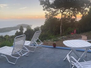 Terrace/patio - Bluewater Cottage with amazing Ocean views. Cozy and romantic. Work & play here. (St Thomas)