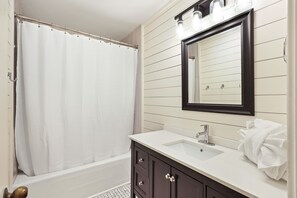 Combined shower/tub, hair dryer, towels, toilet paper