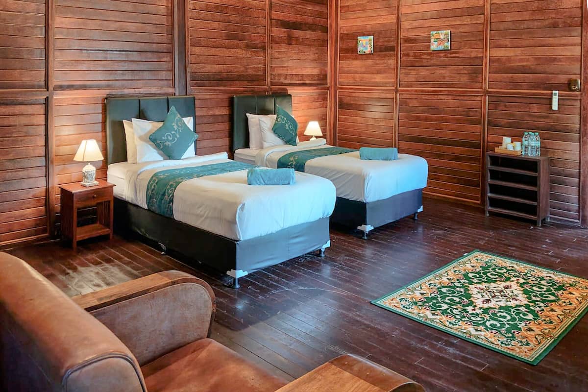Suíte, 2 quartos, vista parcial para o oceano | 1 quarto, frigobar, individualmente decorados