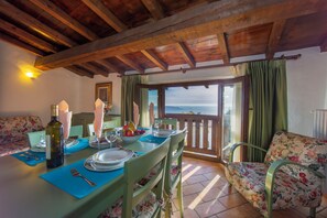Family Apartment, Multiple Bedrooms, Mountainside (Liano Violetta -view lake & parking) | Dining - Liano Iris - Terrace & parking place (Gargnano)