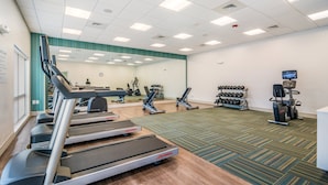 A gym with treadmills, elliptical machines, and weight equipment. - Holiday Inn Express and Suites Asheboro by IHG (Asheboro)
