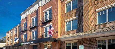 A brick building with a storefront labeled "Holiday Inn Express & Suites."