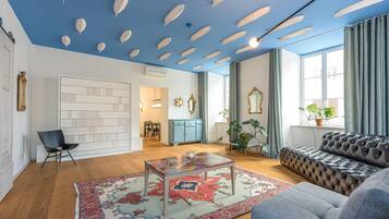 Luxury Apartment, 1 Bedroom (Tromostovje I In Heart of Ljubljana) | Living area | 21-inch flat-screen TV with satellite channels, TV