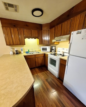 Stocked kitchen with full size appliances. 