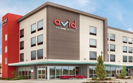 A modern building with the name 'avid' prominently displayed on the facade.