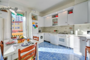 Family Apartment, 2 Bedrooms, 2 Bathrooms, Sea Facing (Sunrise Apartment Seaview) | Private kitchen | Dining tables