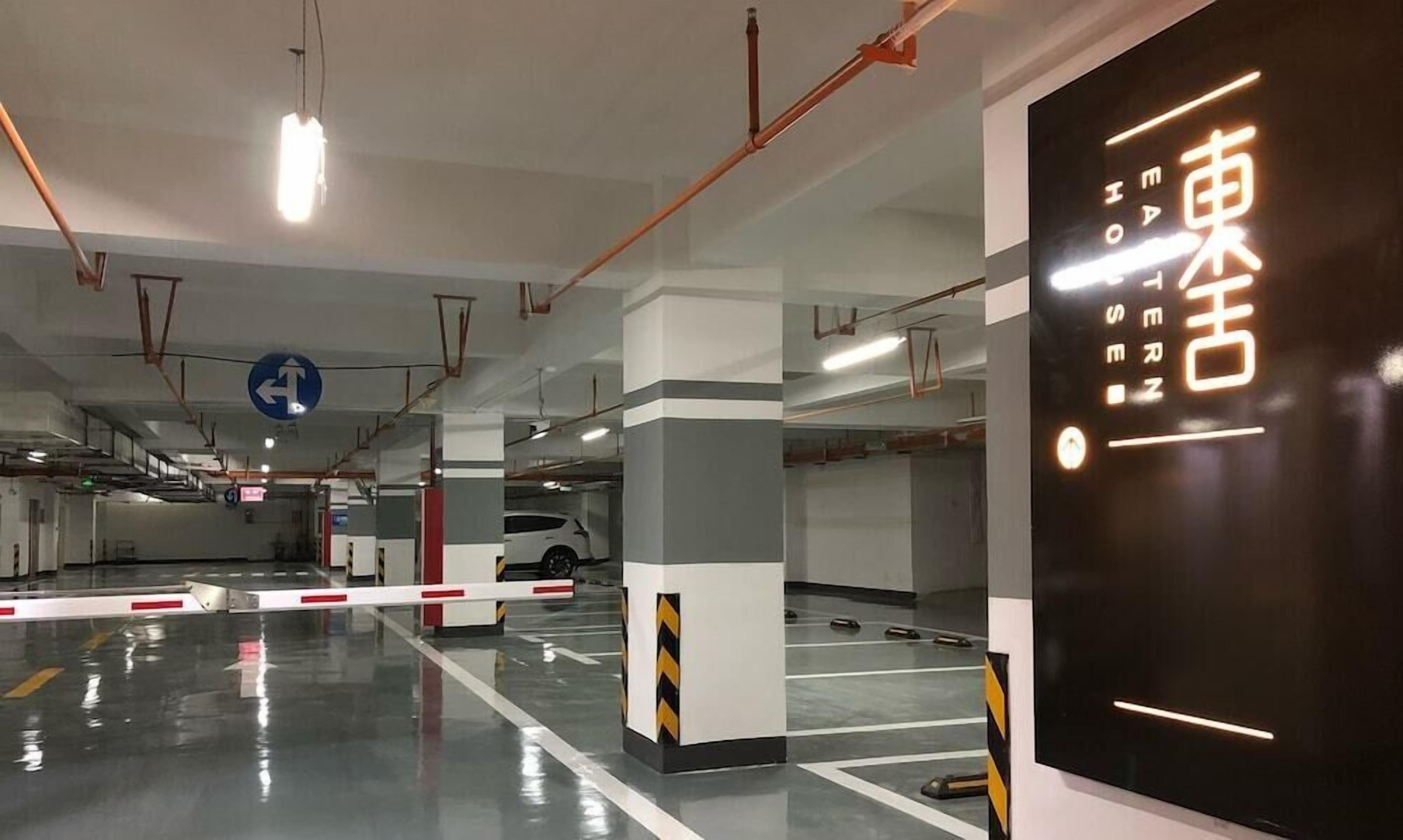 A multi-level parking garage with clear directional signage and a modern design.