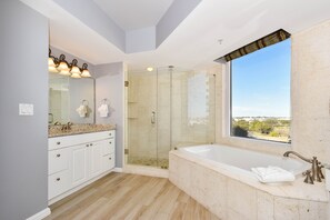 Combined shower/tub, jetted tub, hair dryer, towels