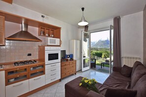 Family House, Multiple Bedrooms, Mountainside (Calla) | Living area | 21-inch flat-screen TV with satellite channels, TV, stereo - Calla (Colico)