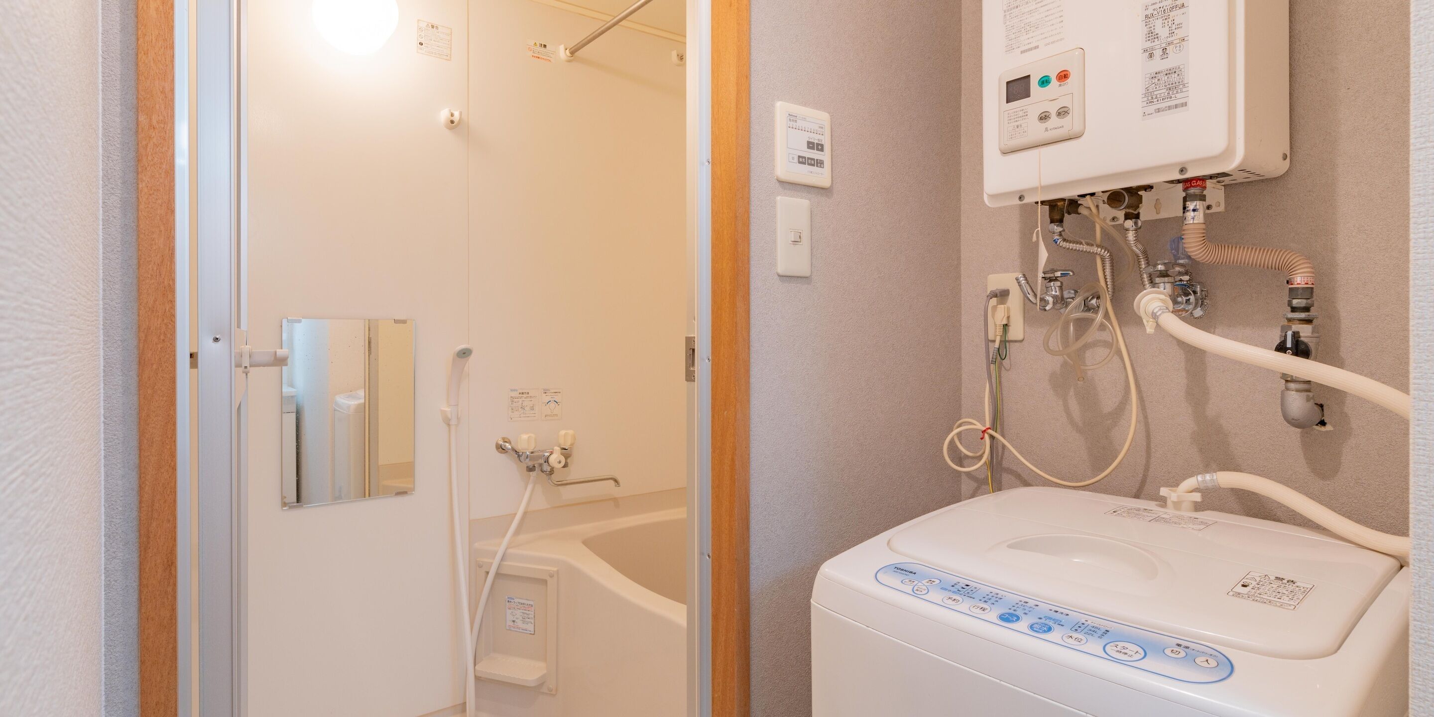 A bathroom with a bathtub, a shower, and a toilet.