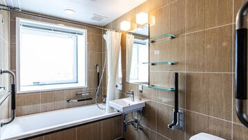 Combined shower/tub, free toiletries, hair dryer, slippers