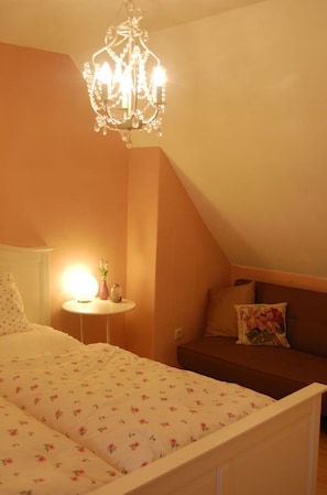Relax in this inviting bedroom with a loft-style design, featuring a plush bed and cozy seating area.
