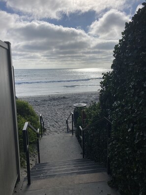 A staircase leading to a beach with a view of the ocean. - Walkable - So Oceanside Gem (Oceanside)