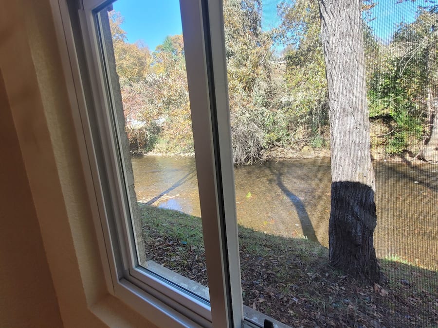 Desk, laptop workspace, blackout drapes, iron/ironing board