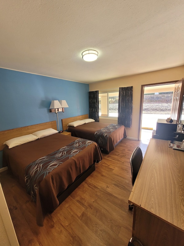 Desk, laptop workspace, blackout drapes, iron/ironing board