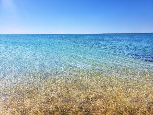 On the beach, sun loungers, beach towels - Beachfront Days' Cottages Updated with Modern Luxuries  (North Truro)