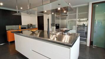 Luxury Villa | Private kitchen | High chair, cookware/dishes/utensils, dining tables