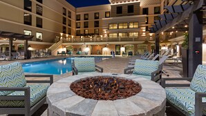 A poolside area with lounge chairs and a fire pit. - Homewood Suites by Hilton St. Augustine San Sebastian (St. Augustine)