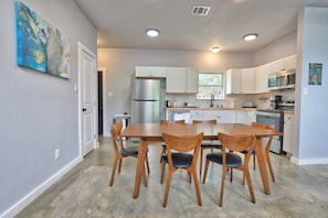 Enjoy cooking in this well-equipped kitchen with a central island and seating area.