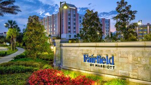 A Marriott Fairfield hotel sign with a landscaped garden in front.
