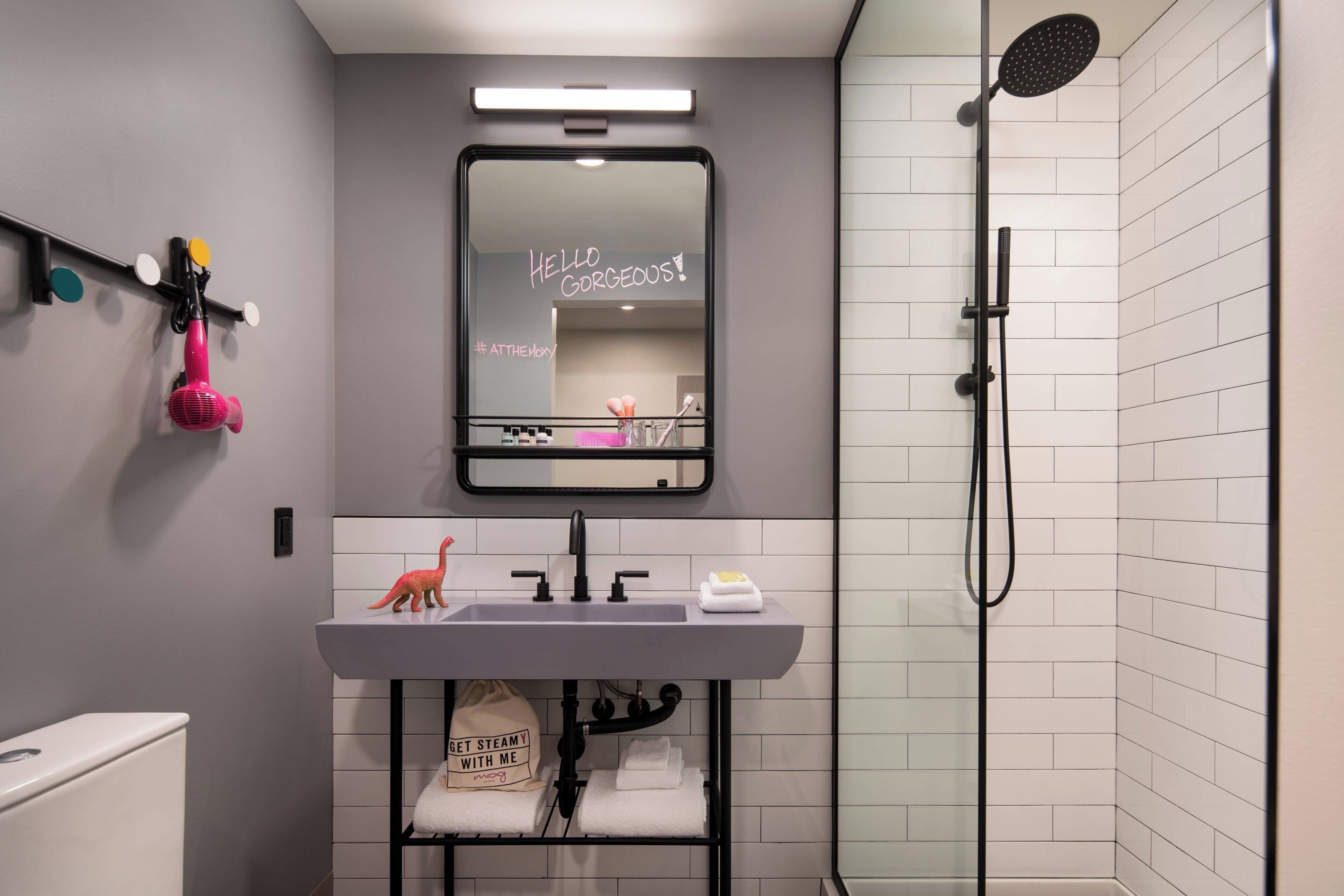 Shower, designer toiletries, hair dryer, towels