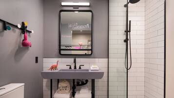 Shower, designer toiletries, hair dryer, towels