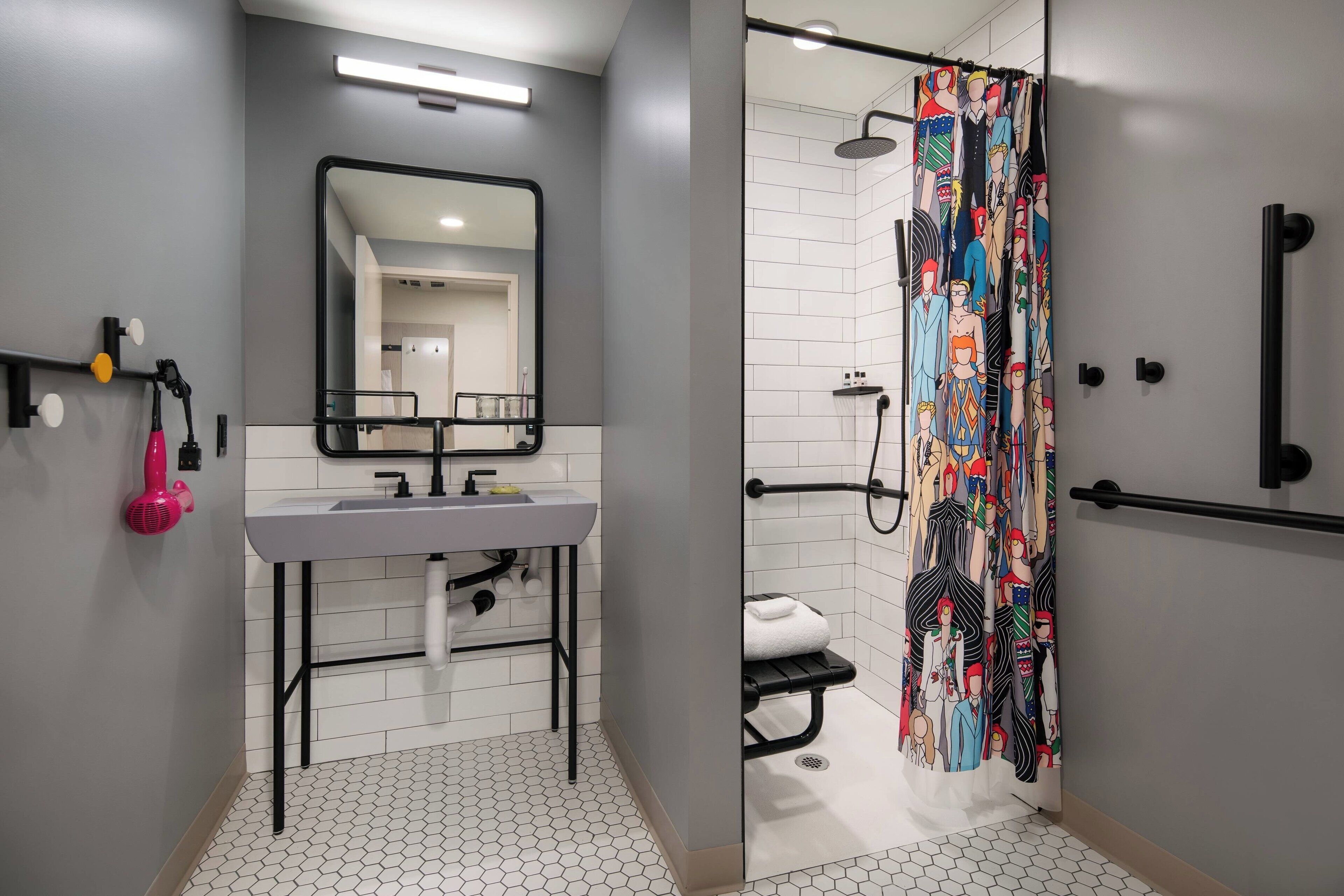 shower, designer toiletries, hair dryer, towels