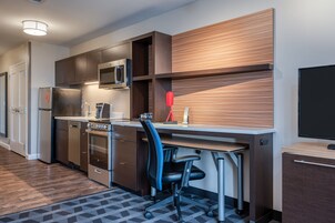 Desk, laptop workspace, blackout drapes, iron/ironing board