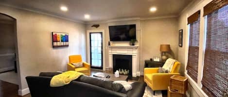 Smart TV, fireplace, books
