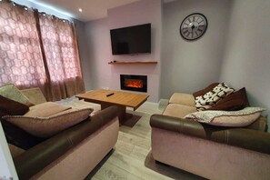 Casa | Zona de estar | Una chimenea