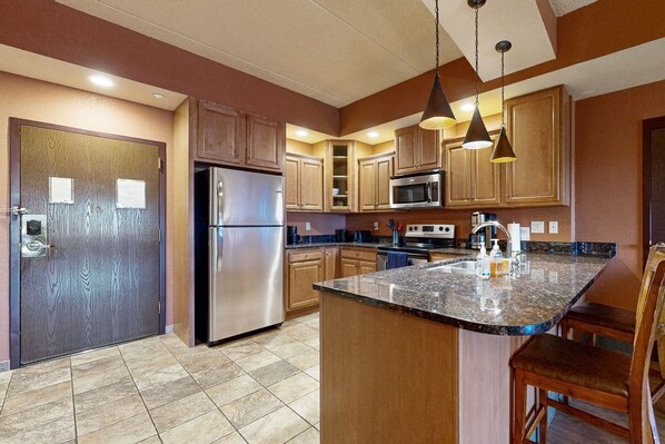 Fridge, microwave, oven, stovetop - Side-by-side condos with in-room Jacuzzi, two fireplaces, & full kitchen (Wisconsin Dells)