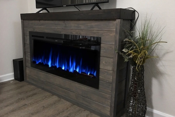 Main level living room fireplace and television