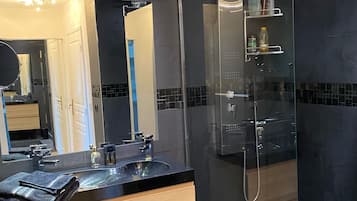 Shower, hair dryer, towels, soap