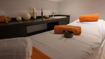 Experience comfort in this serene hotel room with a large bed, vanity, and minimalist design.