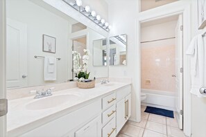 Combined shower/tub, hair dryer, towels, soap