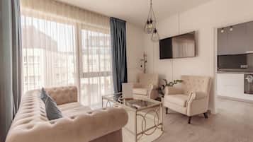 Junior Suite | Living area | 120-cm Smart TV with cable channels, TV, Netflix