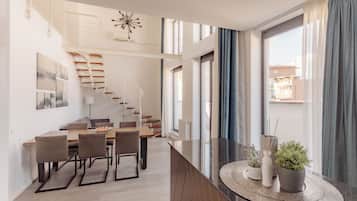 Grand Penthouse | Living area | 120-cm Smart TV with cable channels, TV, Netflix