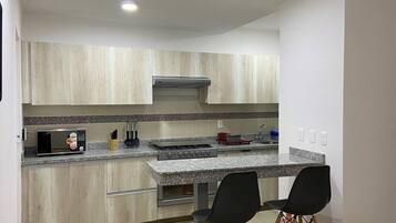 Microwave, coffee/tea maker, cookware/dishes/utensils