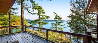 Rustic waterfront cabin w/ free WiFi, a full kitchen, & furnished decks