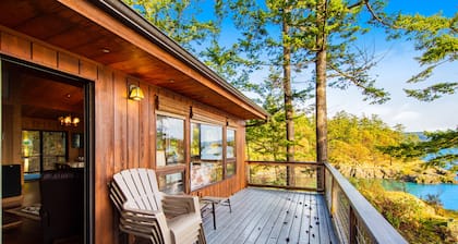 Rustic waterfront cabin w/ free WiFi, a full kitchen, & furnished decks