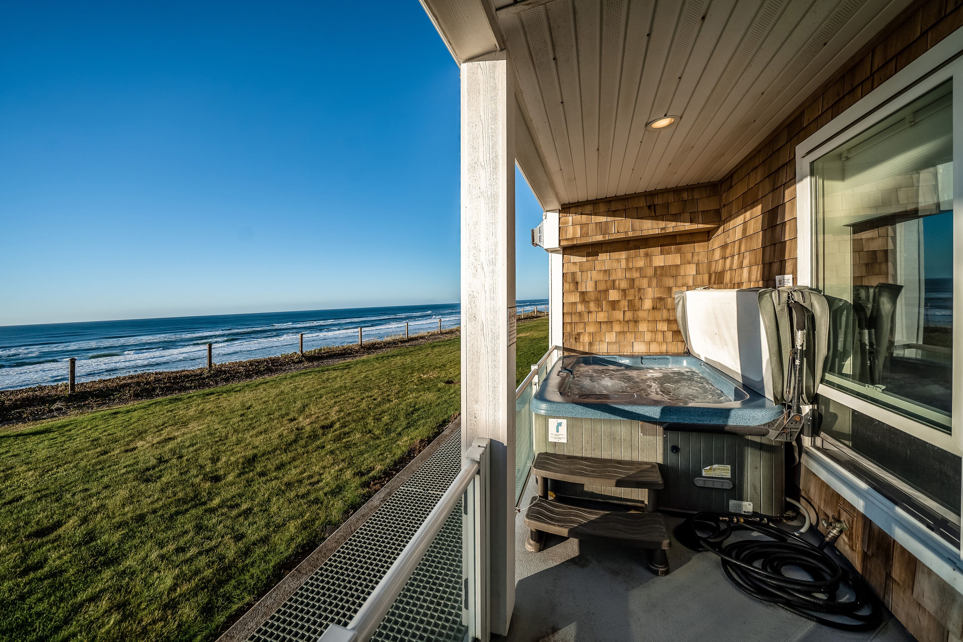 Oceanfront condo with private hot tub, ocean views, and high-speed WiFi