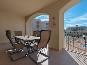 Enjoy meals on the balcony with a table for four and a clear view of the surrounding area.