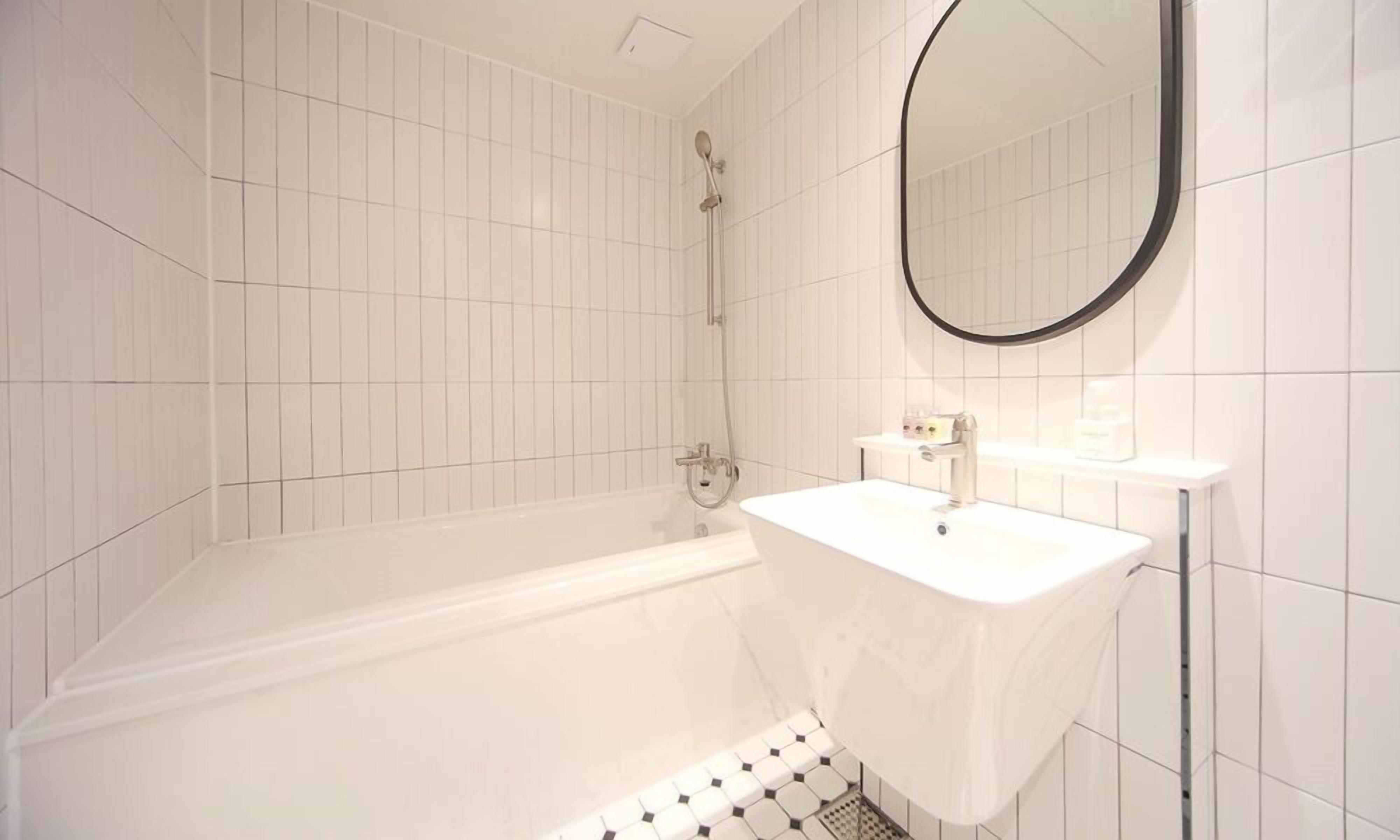 deluxe twin b | bathroom | shower, hair dryer, bathrobes, slippers